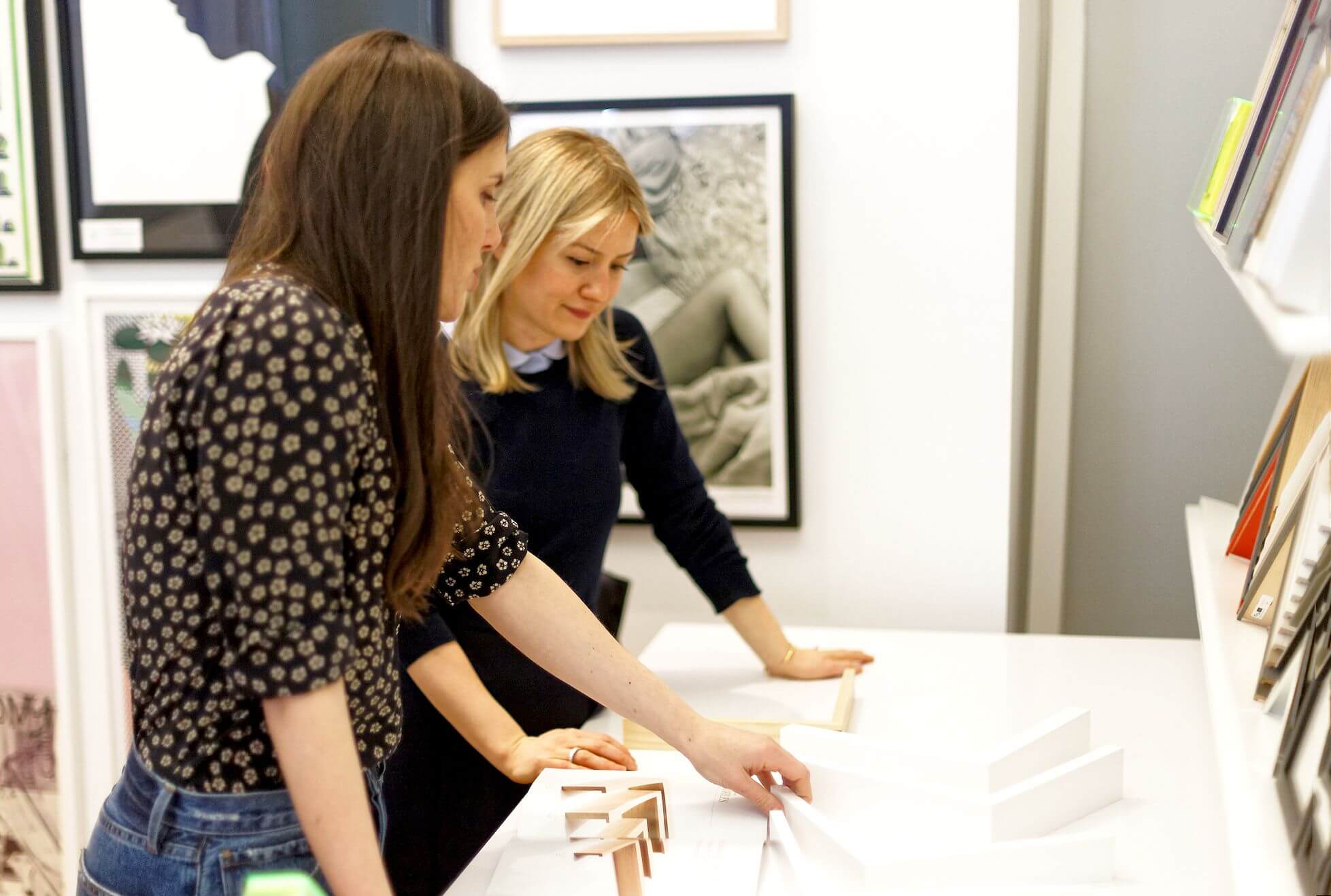 Dara helps a customer at a framing pop-up event at the MoMA Design Store. Photo courtesy of Simply Framed